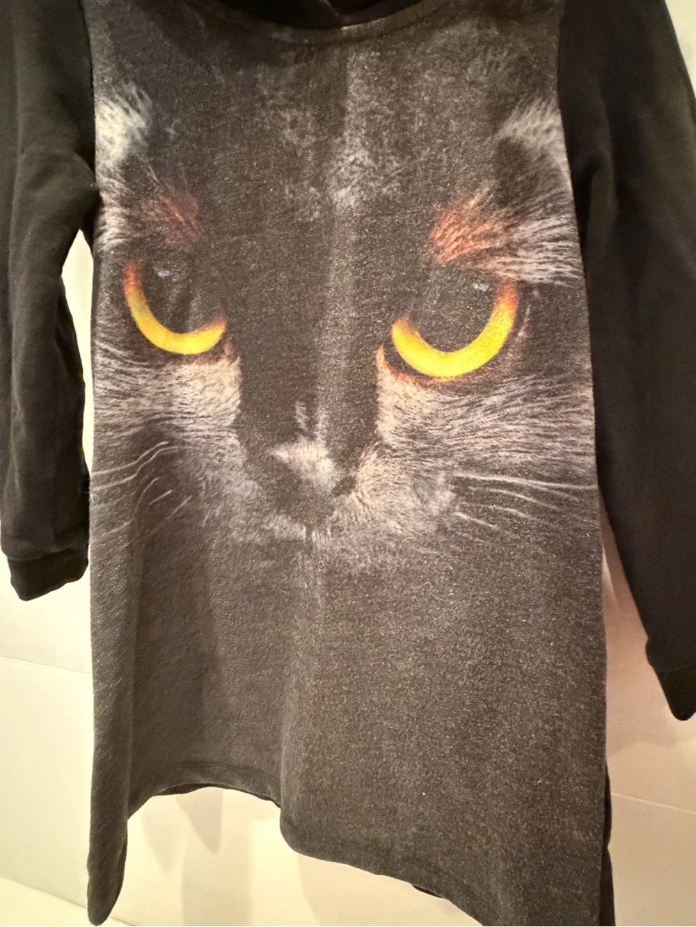 H&M Black Hooded Dress with Yellow Cat Eye Print